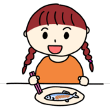 サンマを食べる女の子